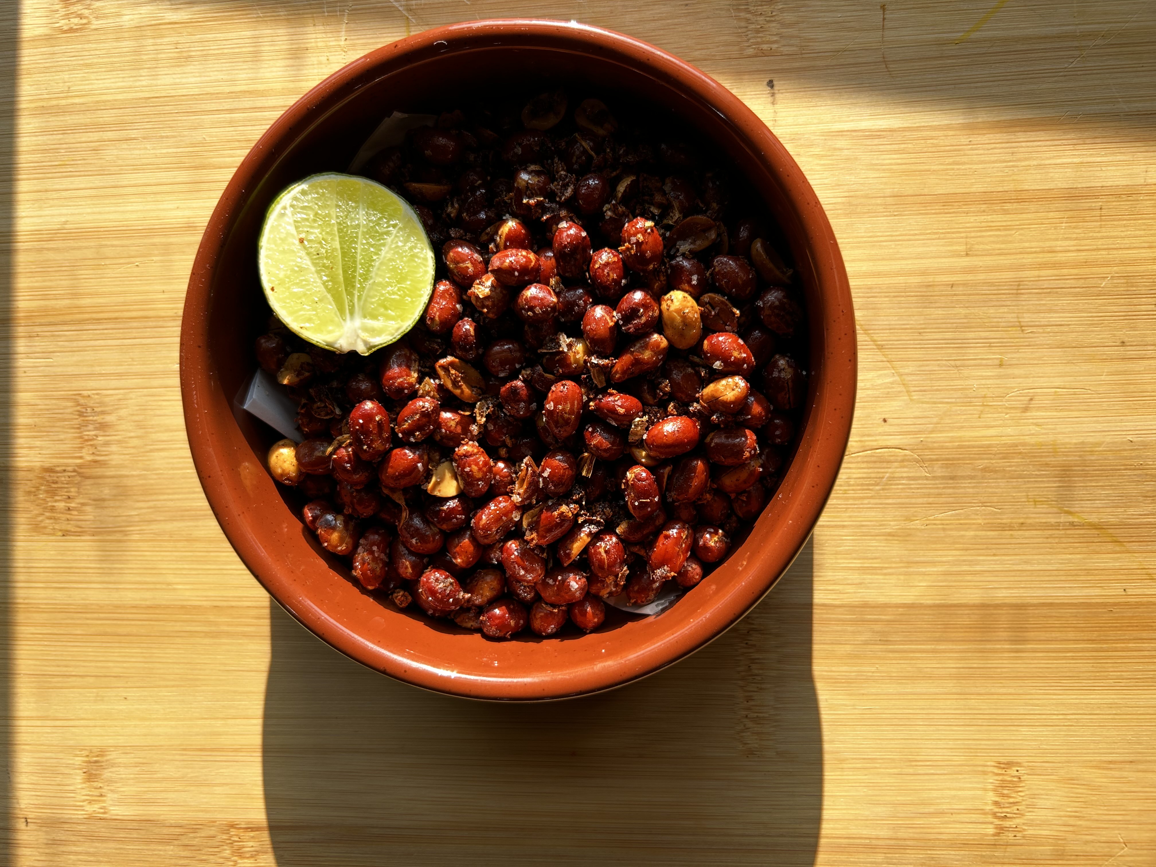 roasted chickpeas in a bowl on a wooden table